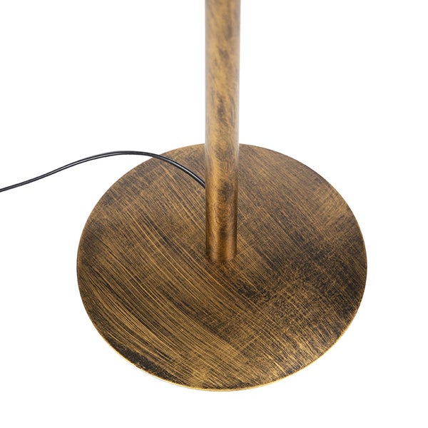 Detailaufnahme des Fußes einer Stehlampe aus Metall
