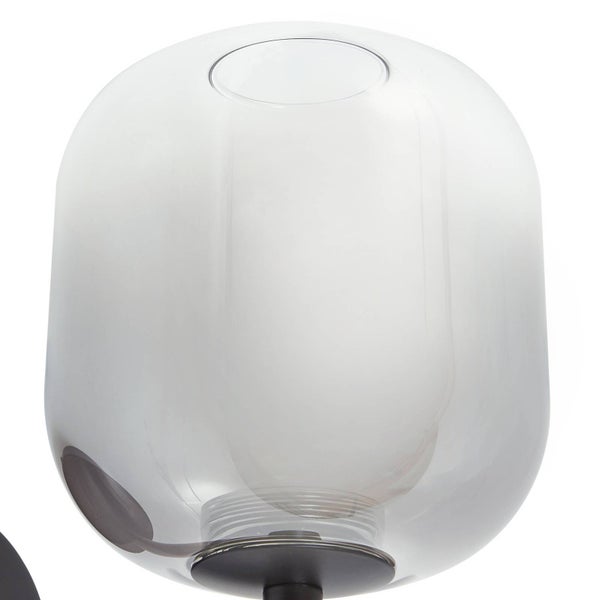 Lampenschirm aus Rauchglas in abgerundeter zylindrischer Form mit dunkler Halterung.