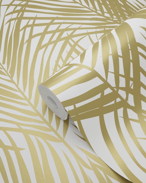 Eine Rolle Tapete mit einem Muster aus Palmwedeln.