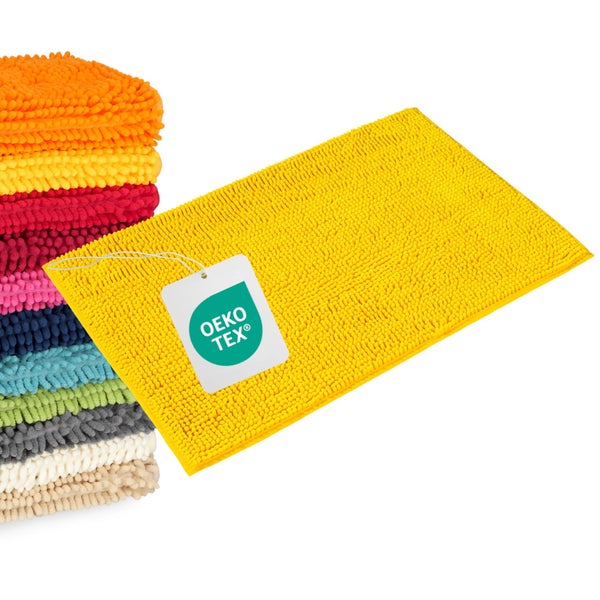 Chenille-Badematte mit weicher Noppenstruktur, Oeko-Tex Standard 100 zertifiziert, in einem Stapel mit weiteren Badematten.