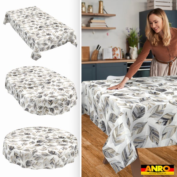 Tischdecke mit Blättermuster in rechteckiger, ovaler und runder Form. Eine Frau streicht das Tischtuch auf einem Küchentisch glatt. ANRO Logo.
