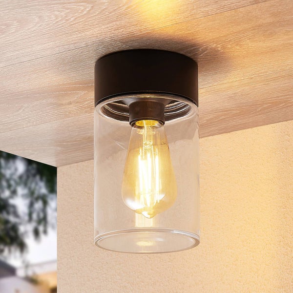 Zylindrische Außen-Deckenleuchte aus schwarzem Metall und klarem Glas mit leuchtender Filament-Glühbirne.