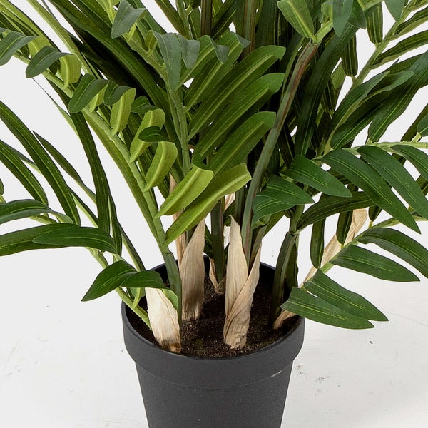 Künstliche Mohnknospe an einem behaarten Stängel mit einem Blatt.