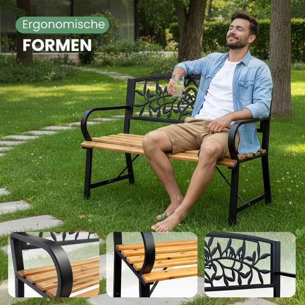 Detail einer Gartenbank mit Metallrückenlehne im Blattdesign und Sitzfläche aus Holzlatten.