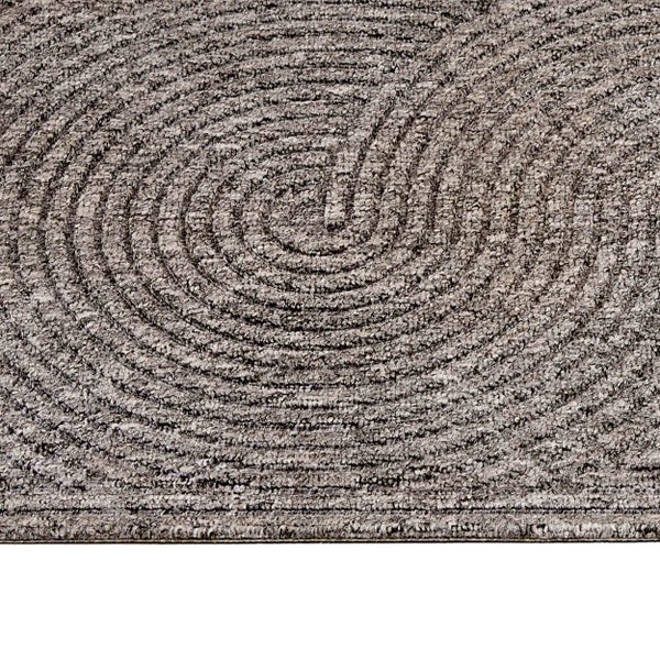 Strukturierter grauer Teppich mit kreisförmigem Spiralmuster