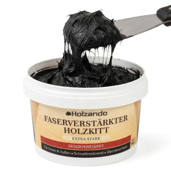 Holzando faserverstärkter Holzkitt in einer Dose, schwarze zähe Paste wird mit einem Metallspachtel entnommen.