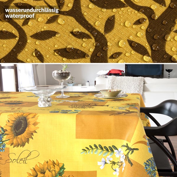 Wasserundurchlässige Tischdecke mit Sonnenblumenmuster und Nahaufnahme von Wassertropfen auf der Oberfläche.