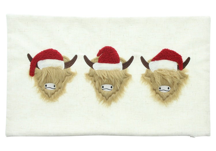 Kissen mit drei schottischen Hochlandrindern mit Weihnachtsmützen