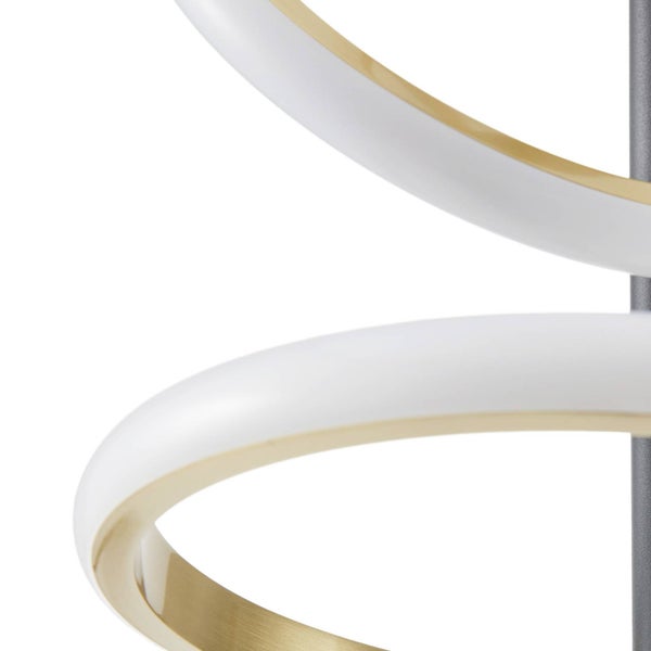 Nahaufnahme einer modernen LED-Leuchte mit geschwungenen weißen Elementen und goldfarbener Innenseite.