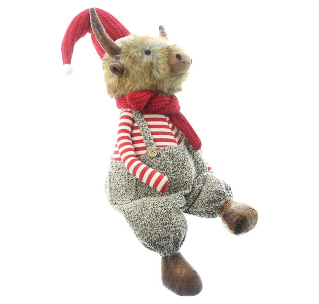 Dekorative Stoffpuppe in weihnachtlicher Kleidung