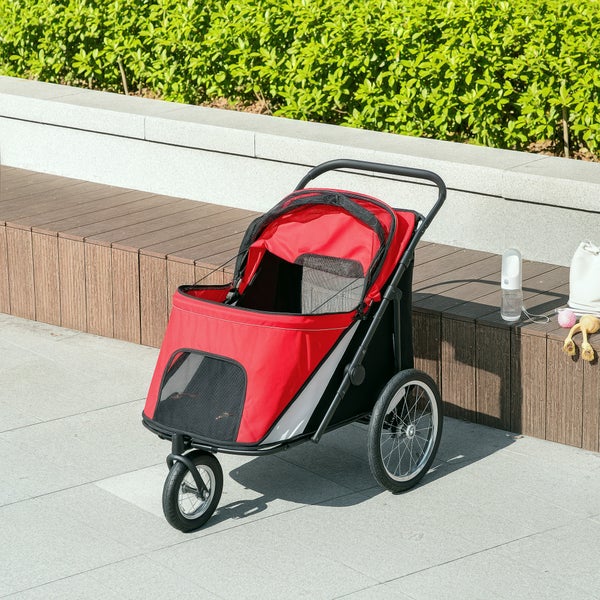 Roter und schwarzer Tierkinderwagen mit drei Rädern