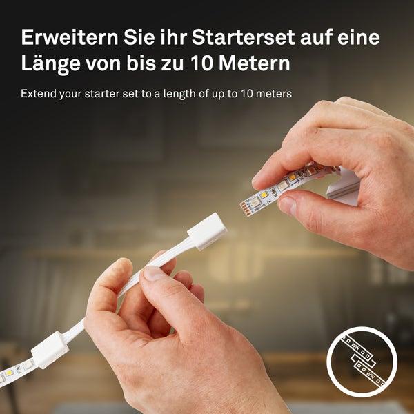 Hände verbinden einen LED-Streifen mit einem weißen Verlängerungskabel zur Erweiterung des Startersets auf bis zu 10 Meter.
