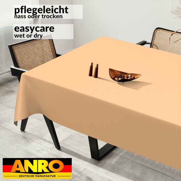 Pflegeleichte Tischdecke auf Esstisch, Stühle mit Geflecht, nass oder trocken abwischbar, ANRO Logo.