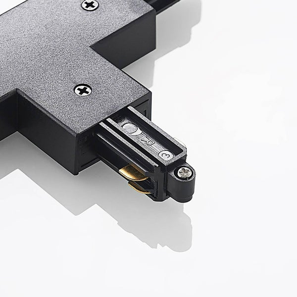 T-Verbinder für 3-Phasen-Stromschienensystem aus schwarzem Kunststoff mit sichtbaren Metallkontakten und Schraubverbindungen.