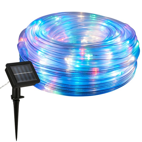 Aufgerollter Solar-Lichtschlauch mit bunt leuchtenden Leuchtdioden und externem Solarpanel mit Erdspieß.