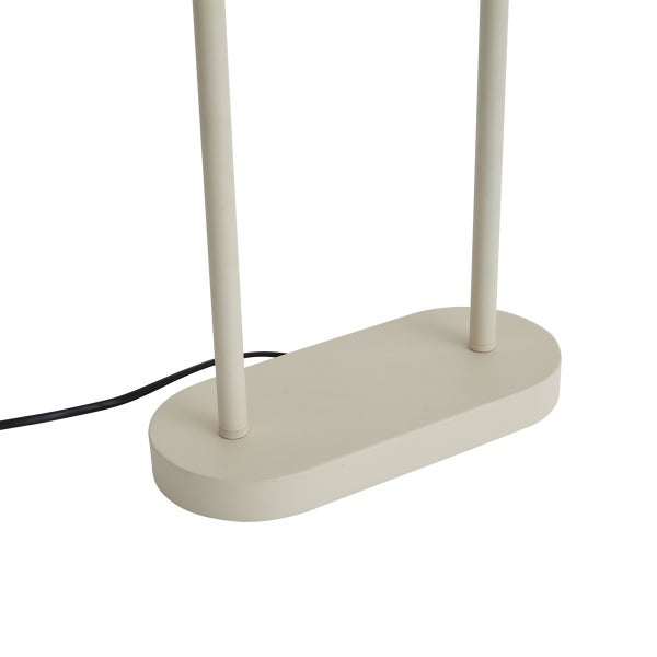 Ovaler Lampenfuß in Beige mit zwei vertikalen Stäben und einem schwarzen Stromkabel.