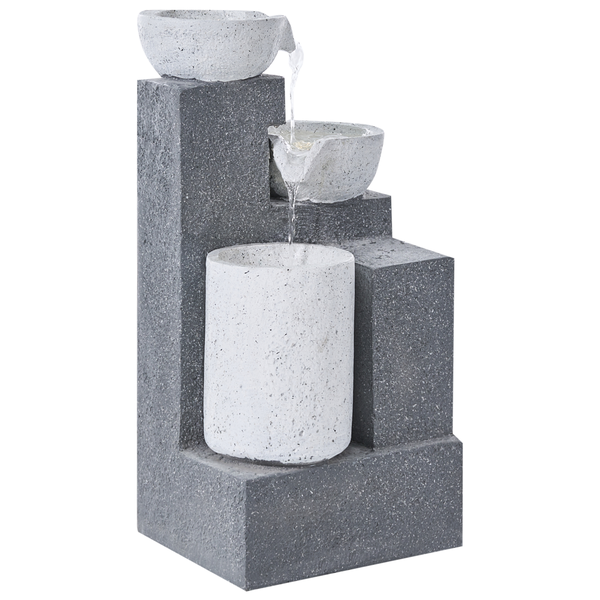 Grauer Kaskadenbrunnen mit zwei weißen Schalen und einem weißen Zylinder auf gestuften Blöcken.