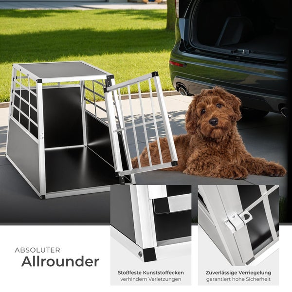 Aluminium Hunde Transportbox mit Hund vor einem Auto