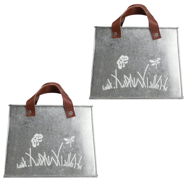 Zwei Zink Pflanzgefäße mit Tragegriffen und Pflanzenmotiven.