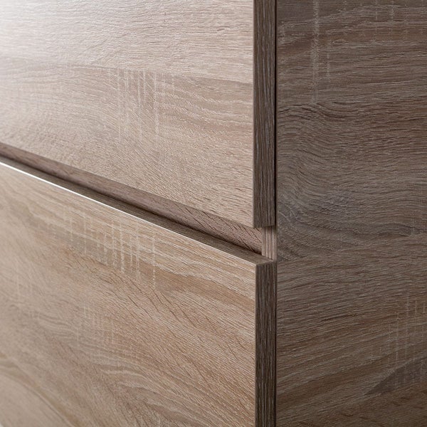 Detailansicht einer Kommodenfront in Holzoptik mit zwei Schubladen und grifflosem Design