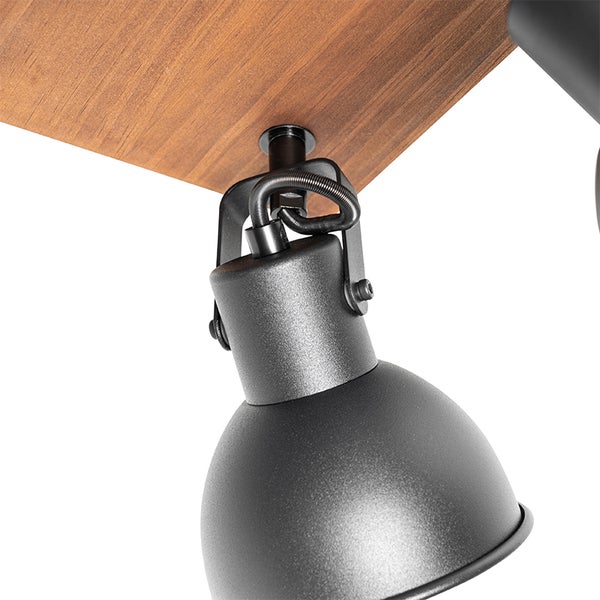Detailaufnahme einer Deckenleuchte mit Holzplatte und verstellbarem Spot