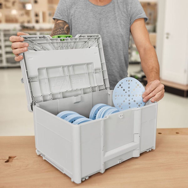 Geöffnete Transportbox mit Schleifscheiben