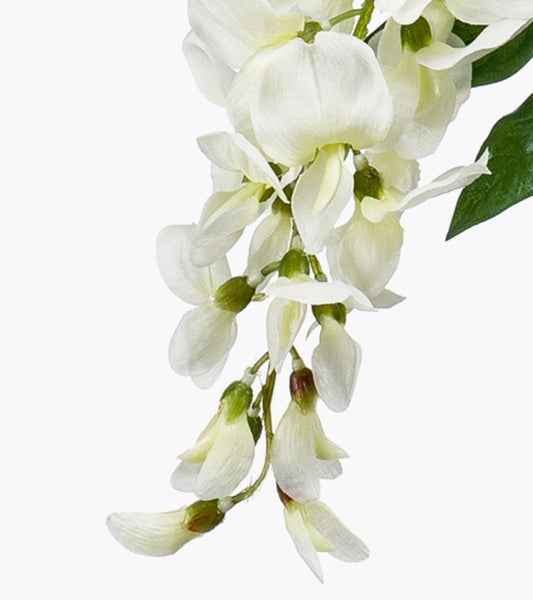 Künstliche Sukkulente mit kleinen länglichen grünen Blättern und orangefarbenen Spitzen.