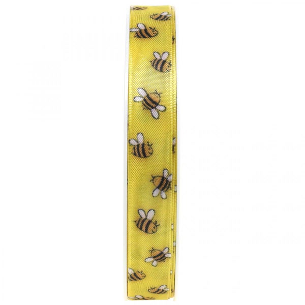 Dekoratives Geschenkband mit Bienenmuster auf Rolle