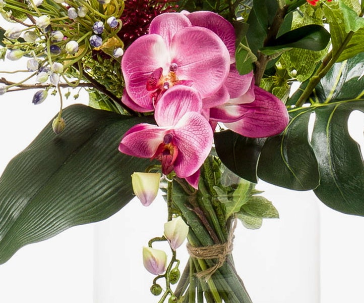 Blumengesteck mit Paradiesvogelblume, Rittersporn, Muschelblume und Dahlie.