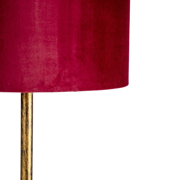 Detail einer Stehlampe mit Stoffschirm und Metallfuß