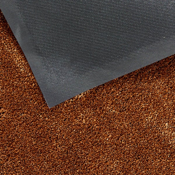 Detailaufnahme einer Fußmatte mit Textiloberfläche und gummierter Rückseite