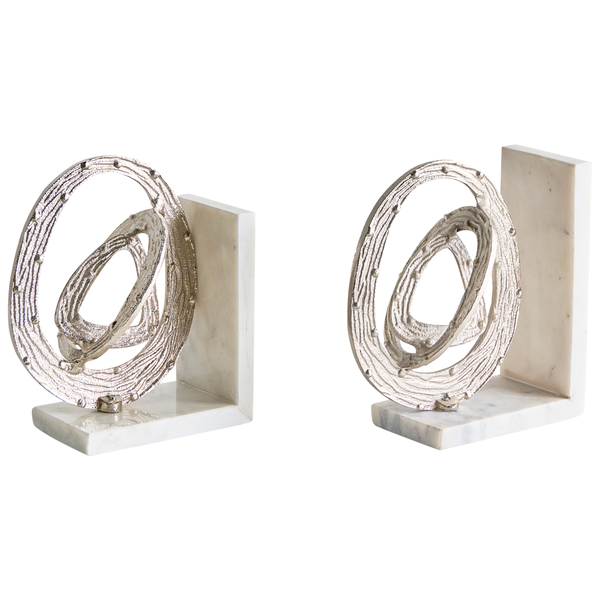 Zwei Buchstützen mit silberfarbenem, kreisförmigem Design auf Marmorsockel