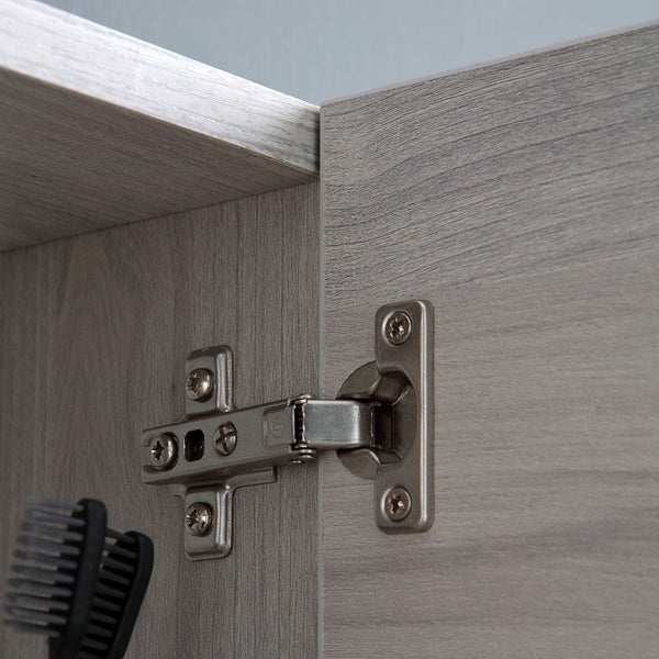 Detailansicht eines Möbelscharniers an einem Holzmöbel