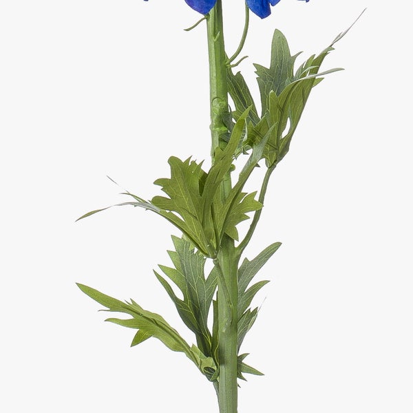 Grüne künstliche tropische Blätter mit tiefen Einschnitten und sichtbarer Blattstruktur.