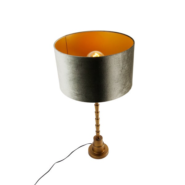 Dekorative Tischleuchte mit Lampenschirm aus Textil und goldenem Gestell