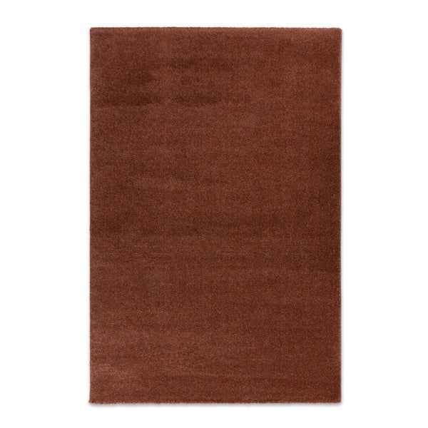 Rechteckiger Hochflorteppich in Rostbraun mit weicher Textur.