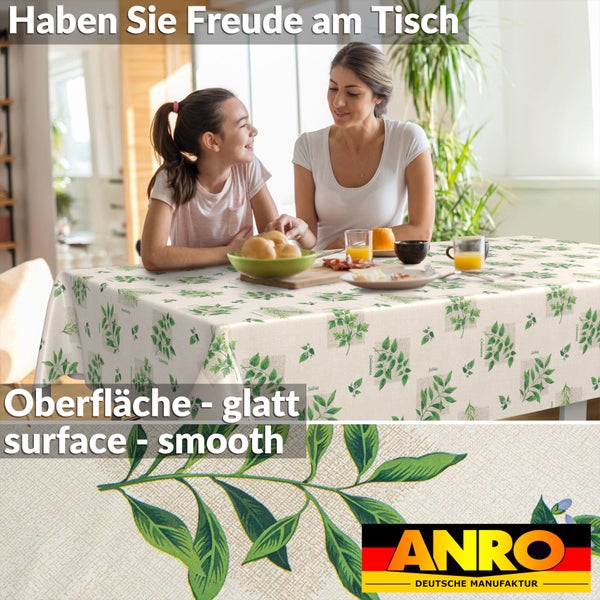 Abwaschbare Tischdecke mit Kräutermotiv auf einem Esstisch in hellem Raum, glatte Oberfläche, ANRO Logo.