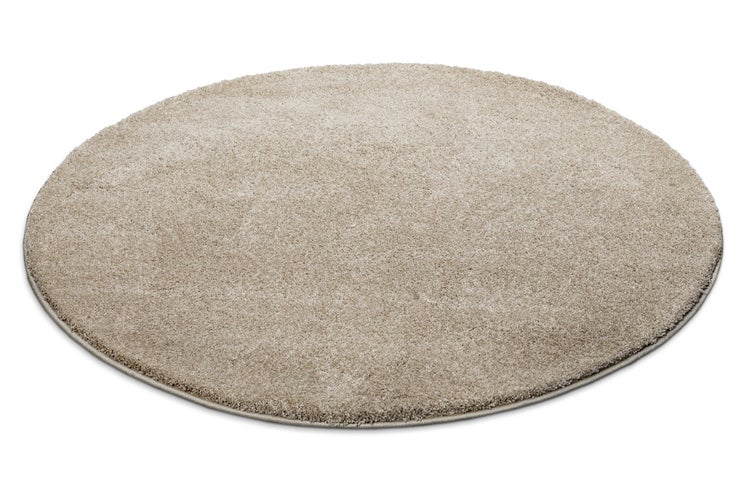 Runder Hochflor-Teppich in Beige.