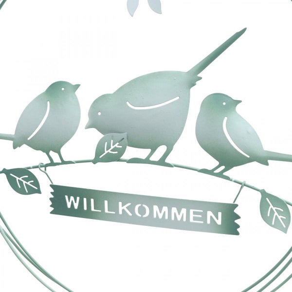 Dekoration mit Vogelmotiv und Willkommen-Schriftzug
