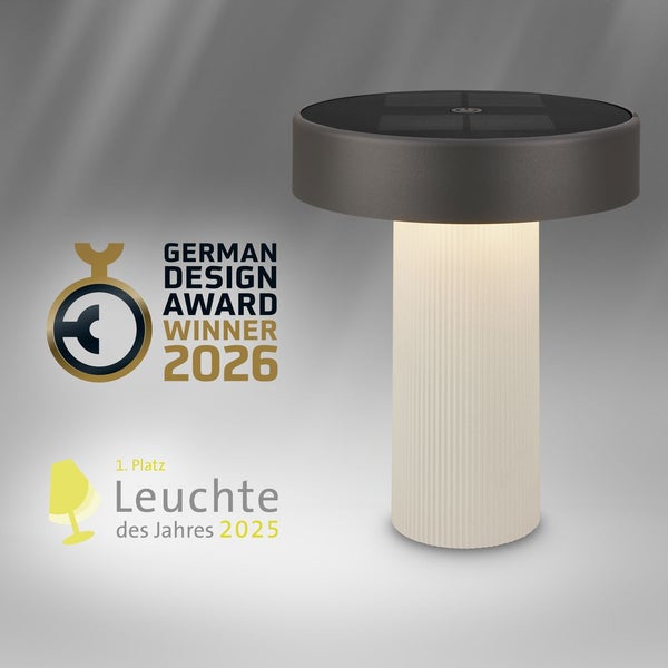 Solar-Tischleuchte mit geriffeltem, beleuchtetem Sockel, German Design Award Winner 2026 und Leuchte des Jahres 2025.