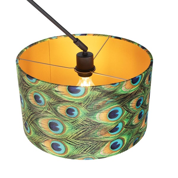 Runder Lampenschirm mit Pfauenfedermuster und goldfarbener Innenseite, inklusive schwarzer Fassung und Leuchtmittel.