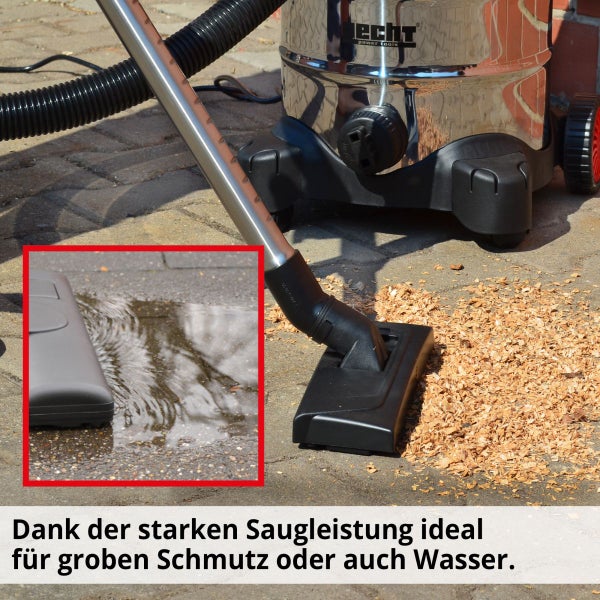 Hecht Nass- und Trockensauger mit Edelstahltank saugt Sägespäne und Wasser auf einem Steinboden auf.