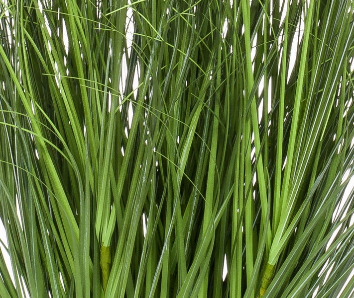 Nahaufnahme von grünem künstlichem Ziergras.
