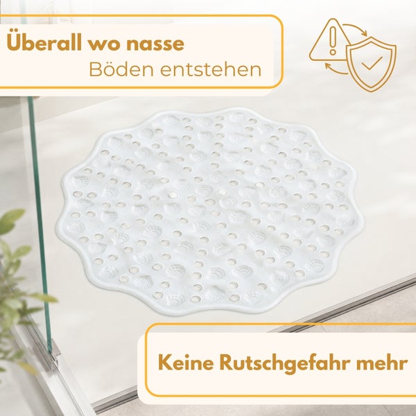 Weiße Antirutschmatte für die Dusche in Blumenform mit Muscheldesign und Löchern für den Wasserabfluss.