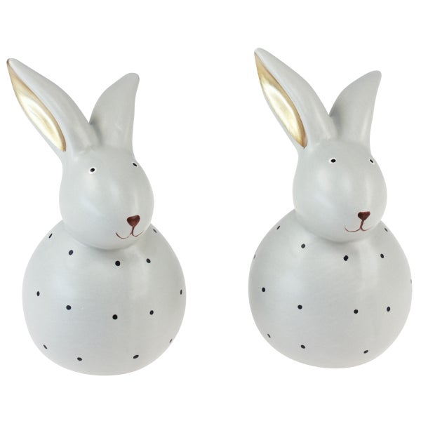 Zwei dekorative Hasenfiguren mit Punktmuster für die Osterdekoration