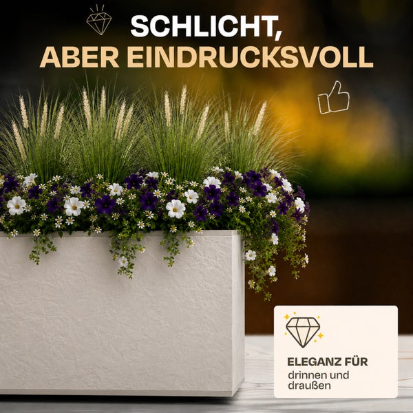 Texturierter rechteckiger Pflanzkasten mit Ziergräsern und Blumen, geeignet für den Innen- und Außenbereich.