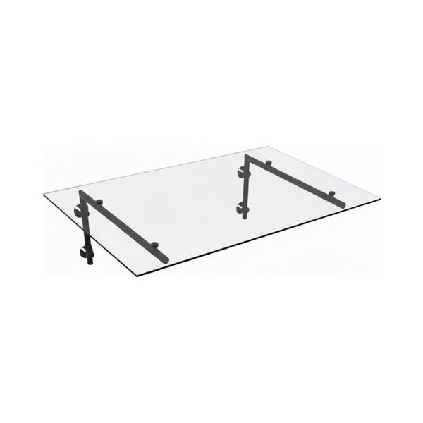 Modernes Haustürvordach aus klarem Glas mit schwarzen Halterungen.