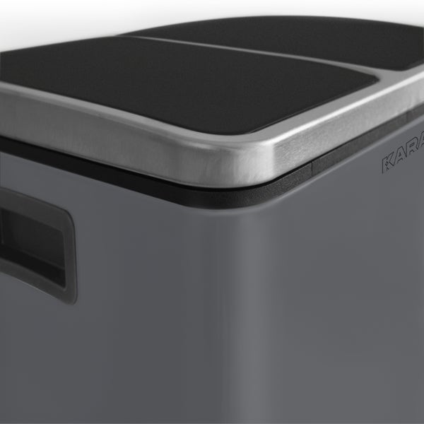 Detailansicht eines anthrazitfarbenen Heizkörpers mit Anschlüssen