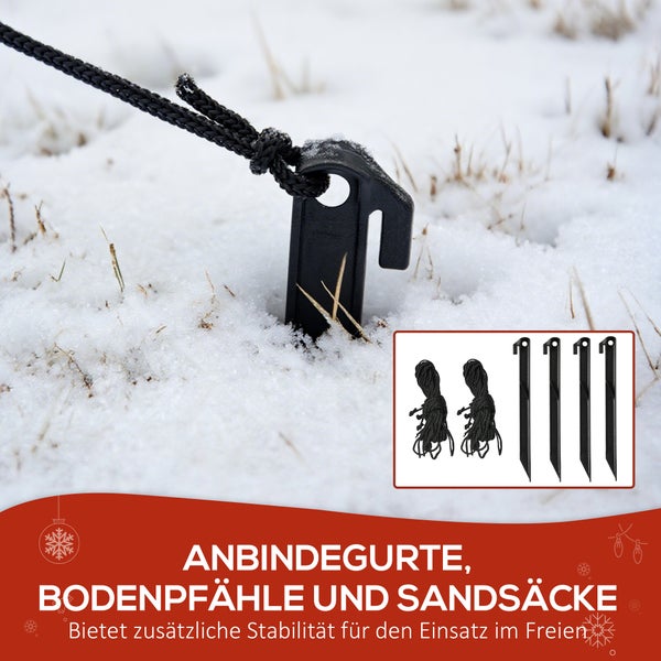 Set aus schwarzen Bodenpfählen und Anbindegurten zur Sicherung von Außendekoration im Schnee für zusätzliche Stabilität.