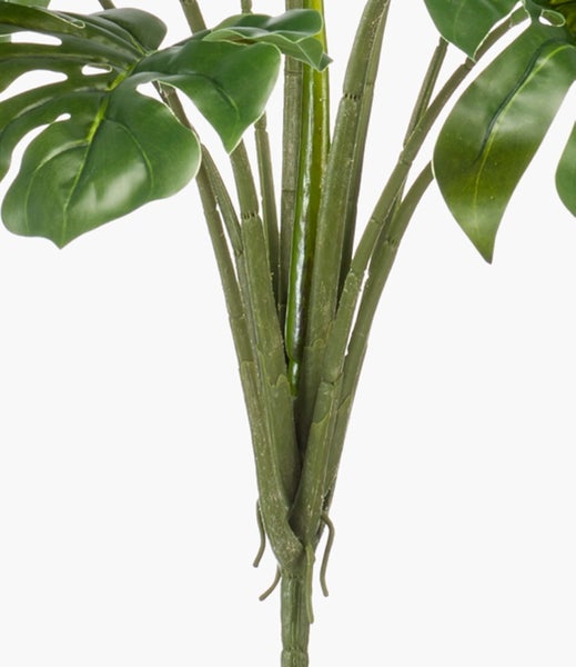 Künstliche Dahlie in Rosa mit grünem Stängel und Blättern.